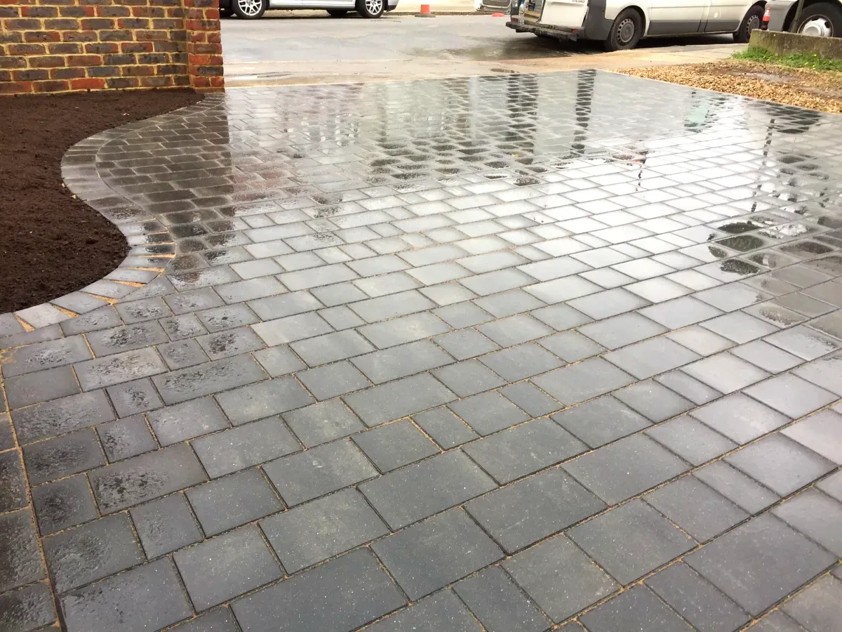 Freshly cleaned grey block paving driveway