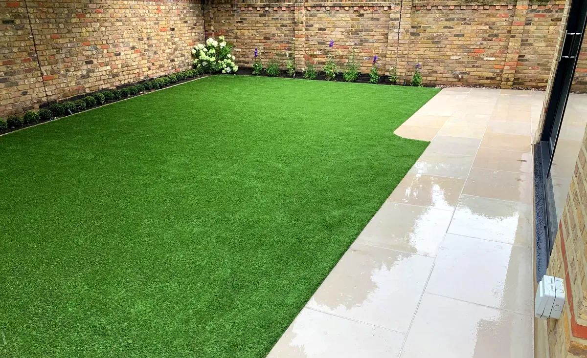 Garden transformation with turf and porcelain patio