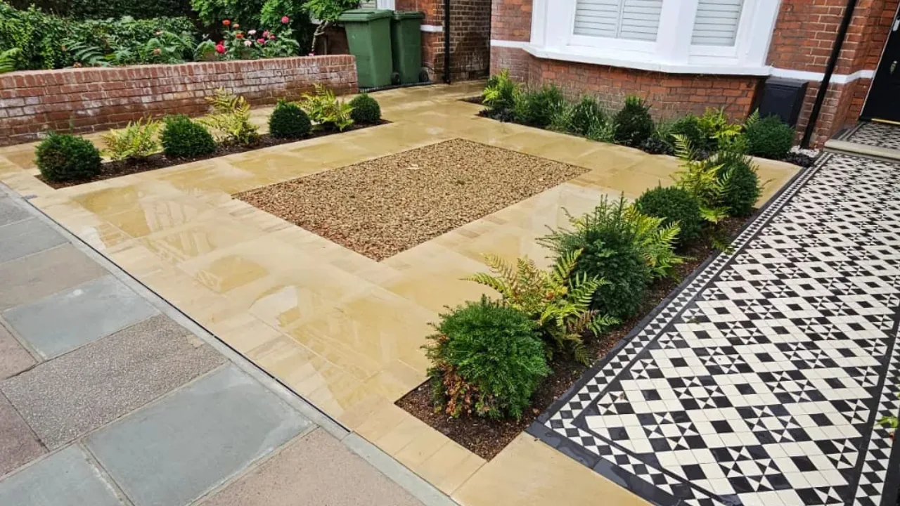 Sandstone driveway and brick walling in West London