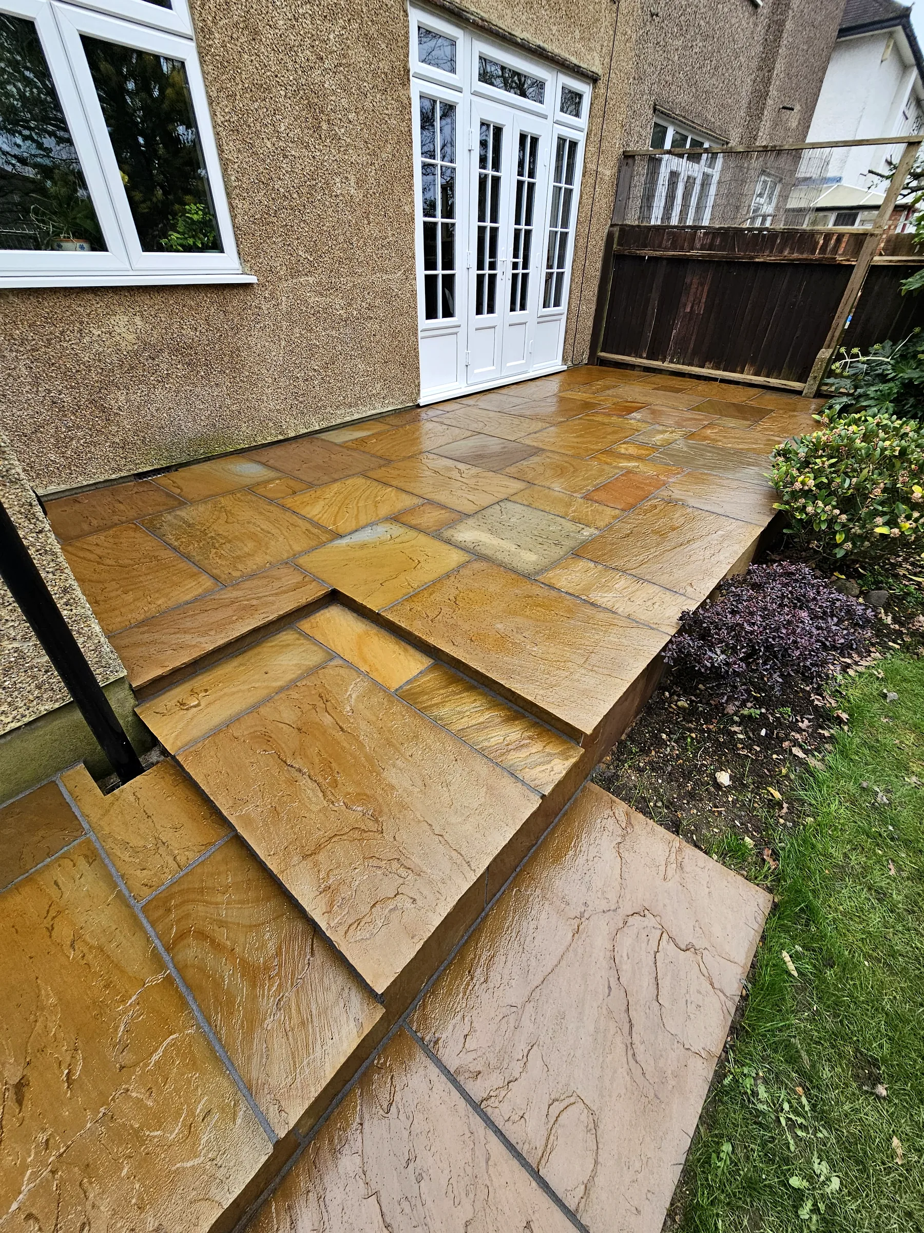 Indian sandstone patio with circular feature
