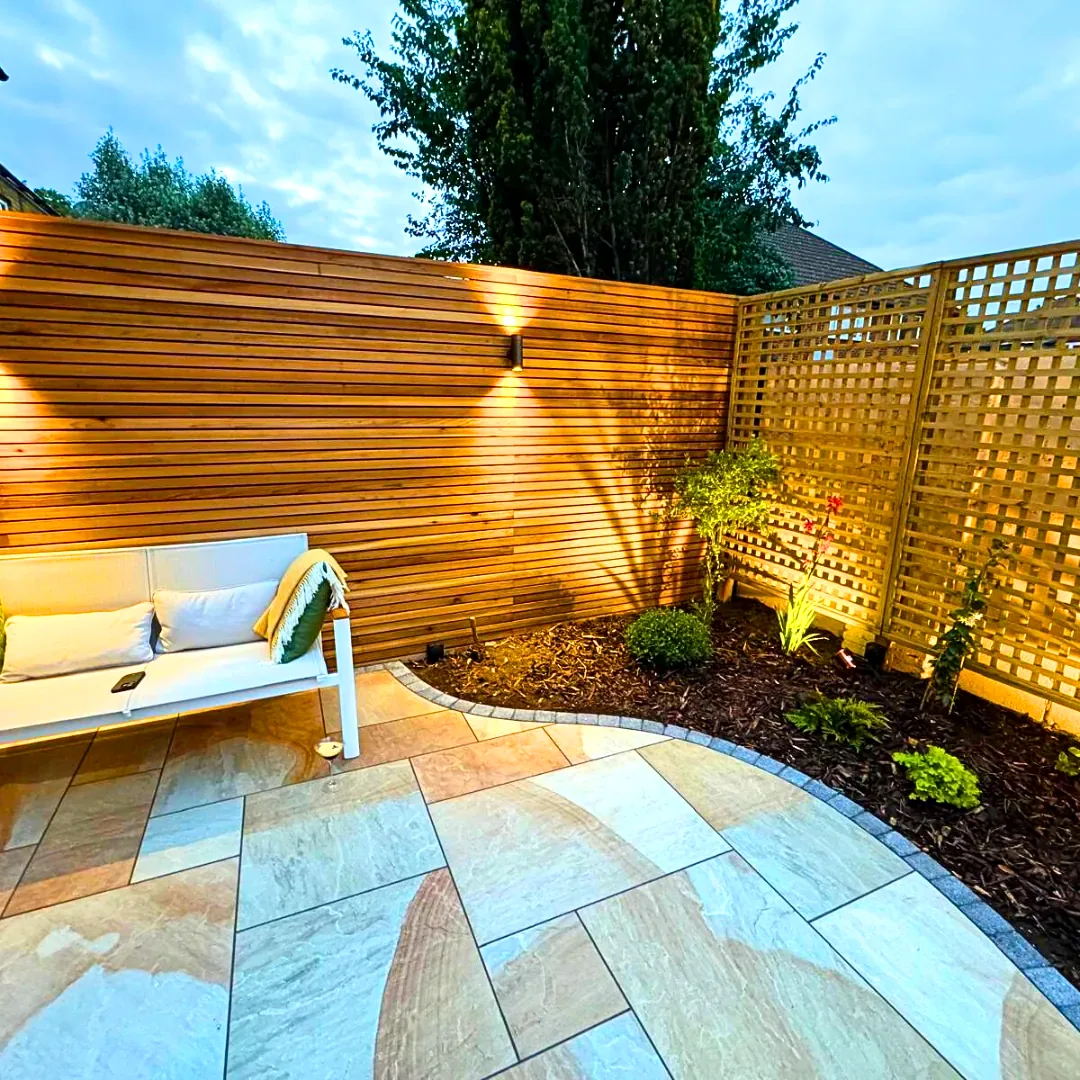 Sandstone patio with timber slatted fence in Twickenham